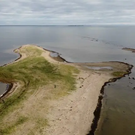 Aerial shot of serene peninsula landscape with beach and sea, Pärnu, Estonia.